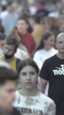 Vertical video of a crowd of people in the city
