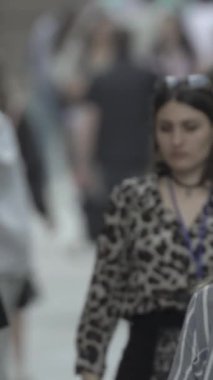 Vertical video of a crowd of people in the city