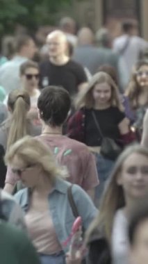 Vertical video of a crowd of people in the city