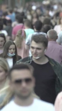 Vertical video of a crowd of people in the city