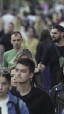 Vertical video of a crowd of people in the city