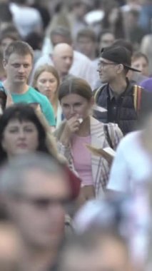 Vertical video of a crowd of people in the city