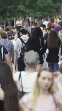 Vertical video of a crowd of people in the city