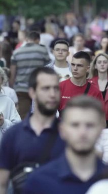 Vertical video of many people in the city