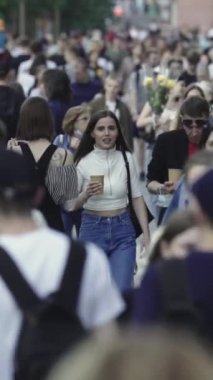 Vertical video of many people in the city