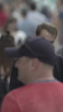 Vertical video of many people in the city