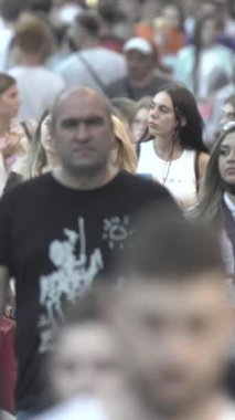 Vertical video of many people in the city
