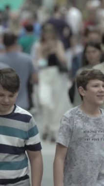 Vertical video of a crowded street