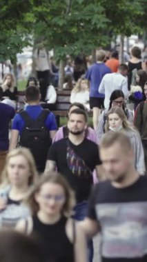 Vertical video of a crowded street