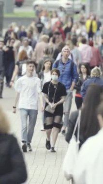 Vertical video of a crowded street