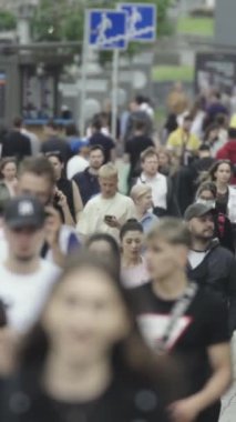 Vertical video of a crowded street