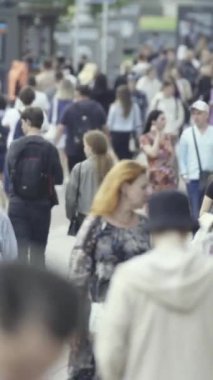 Vertical video of many people in the city