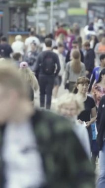 Vertical video of a crowded street in a metropolis