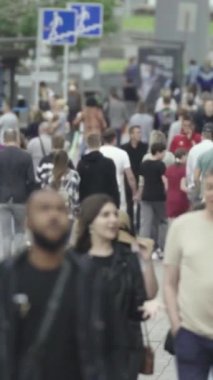 Vertical video of a crowded street in a metropolis
