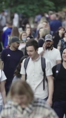 Vertical video of a crowded street in a metropolis