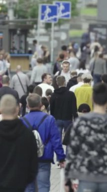 Vertical video of a crowded street in a metropolis