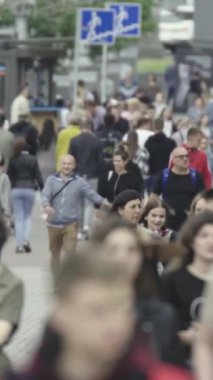 Vertical video of a crowded street in a metropolis