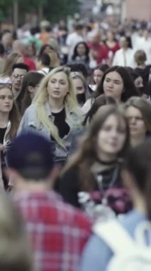 Vertical video of a crowded street in a metropolis