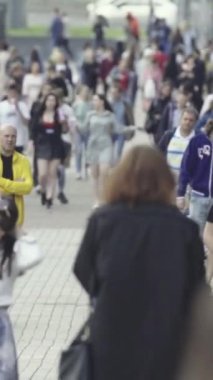 Vertical video of a crowded street in a metropolis