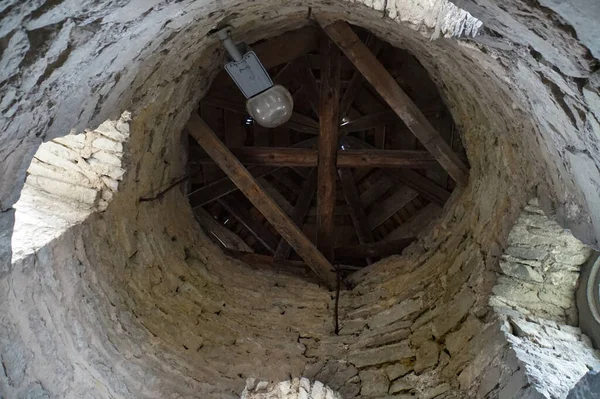 Deep well for water with brick-lined walls.