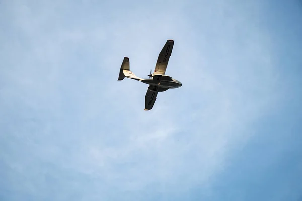 A small plane flying in the sky.