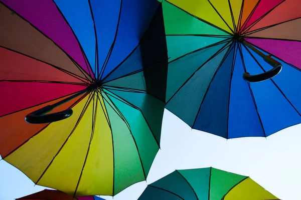Hanging multi-colored umbrellas. Unusual decor.