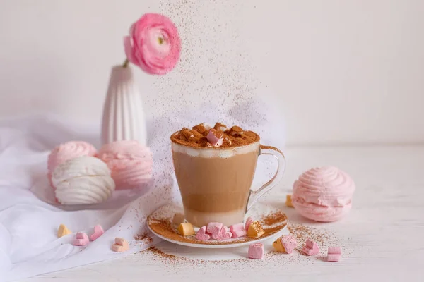 cup of coffee with marshmallows on white background