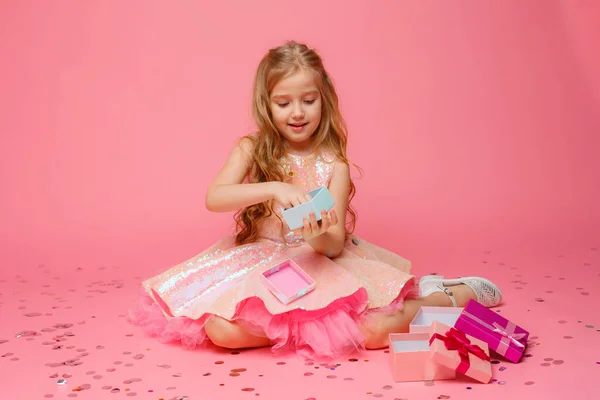 Little Girl Holding Gift Her Hands Smiles Pink Background — Stock Photo, Image