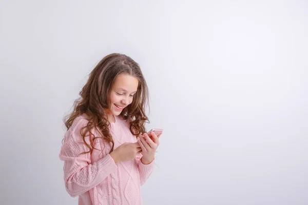 Portrait Beautiful Young Girl Pink Sweater Using Phone Royalty Free Stock Images