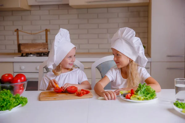 Two Cute Funny Girls Posing Chef Hats Vegetables Table — Stock Photo, Image