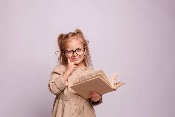 Little Schoolgirl Girl Glasses Hold Book Gray Background — Stock Photo, Image