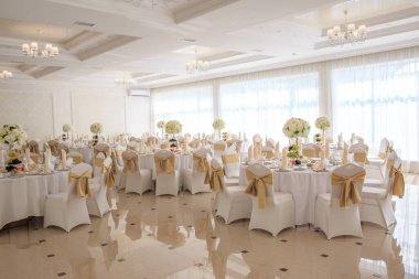 Decorated wedding banquet hall in classic style. Restaurant interior for banquet, wedding deco