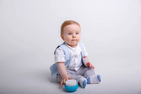 Cute Baby Boy Sitting Toy Floor Studio Gray Background — Stock Photo, Image
