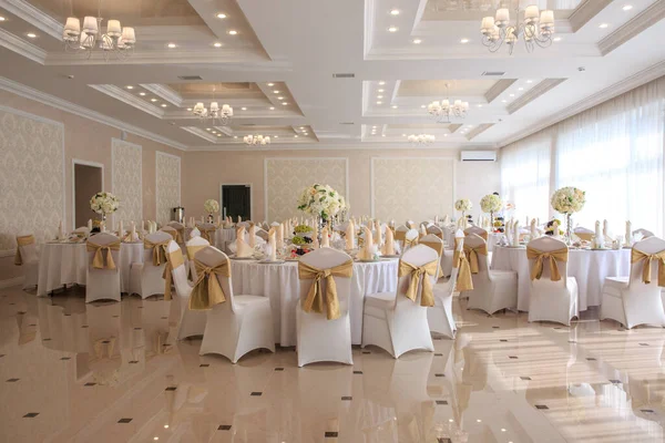 Decorated wedding banquet hall in classic style. Restaurant interior for banquet, wedding deco