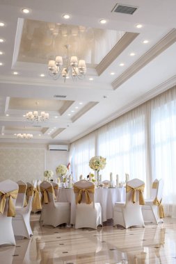 Decorated wedding banquet hall in classic style. Restaurant interior for banquet, wedding deco
