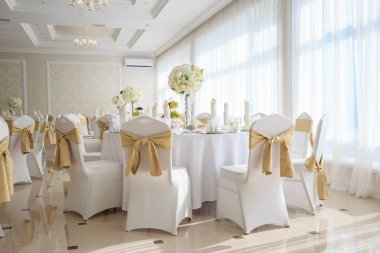 Decorated wedding banquet hall in classic style. Restaurant interior for banquet, wedding deco