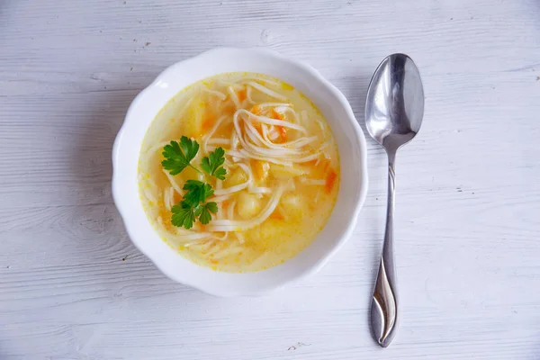 Chicken noodle soup on white background