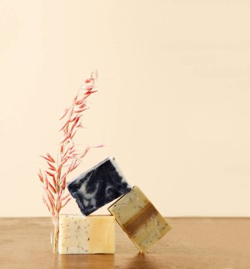 Handmade soap on a beige background. Concept of body care product with copy space copying