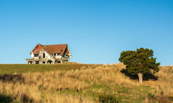 One Very Old Run House Hill Royaltyfria Stockbilder