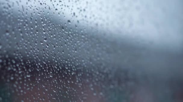 Transport, road, railway, landscape, comnication concept - close up drips of rain flow down window glass of high-speed train. travel through countryside by rail. running streams of water background — Stock Video