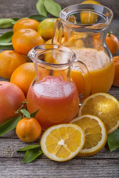 Tangerine juice on wood — Stock Photo, Image