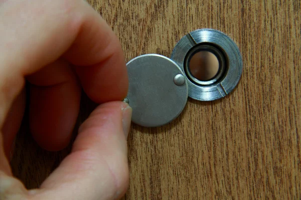 Looking through peephole — Stock Photo, Image