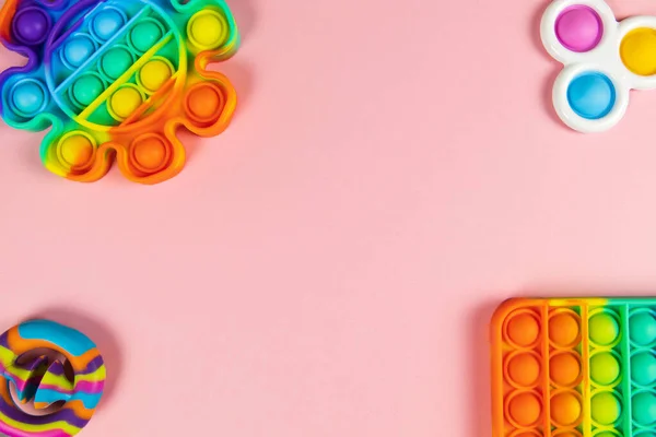 Zabawki Antystresowe Wyskakują Proste Dołeczki Migawki Różowym Tle Przestrzeń Kopiowania — Zdjęcie stockowe