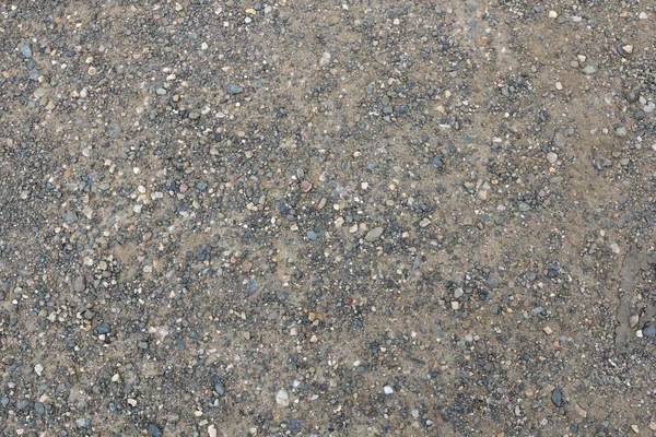 Kies- und Stauboberfläche mit kleinen Steinen — Stockfoto