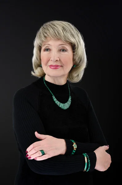 Portrait of stunning 76-year-old woman wears malachite set — Stockfoto
