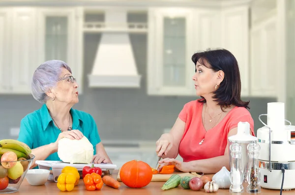 A kindly daughter or hired actress from a rental family service regularly visits her old mother or customer to cook a vegetable dish together. It is very important to pay attention to elderly parents.