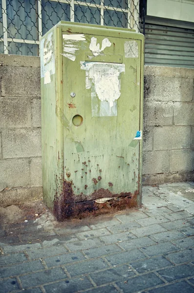 Dogs pissed a green mail storage box so that it will soon completely rot.