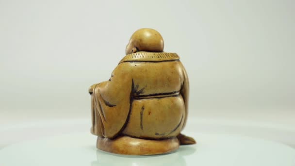 Buddha statuette on rotating plate — Stock Video