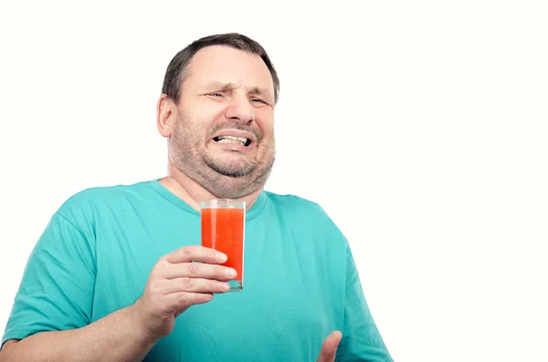 Fat man is filled with disgust by detox drink — Stock Photo, Image