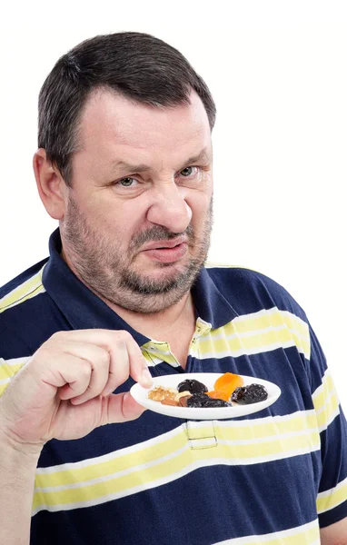 Guy has a deep-seated aversion to dried fruits — Stock Photo, Image